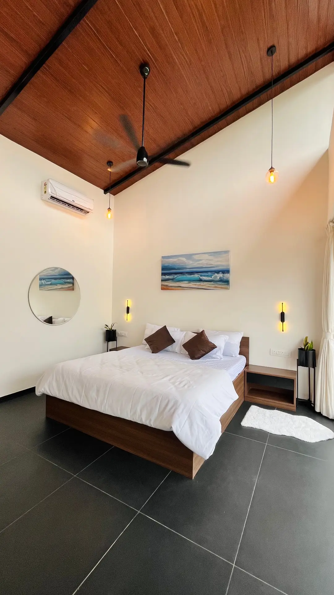 Reference photo 1c: wide view with wood ceiling, mirror and bedside tables